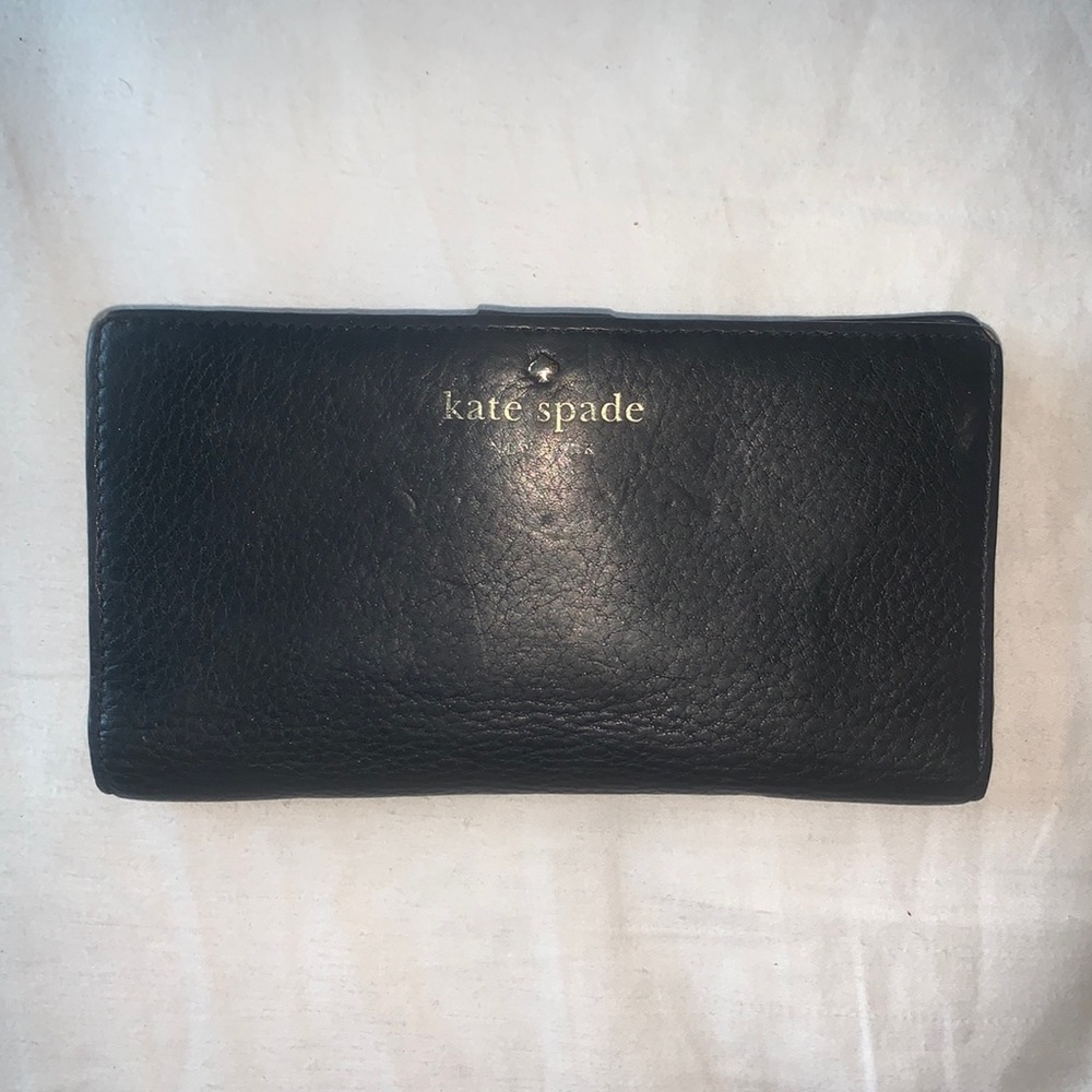 Kate Spade Leather Black Wallet. 15 card pockets, plus 5 additional sections.